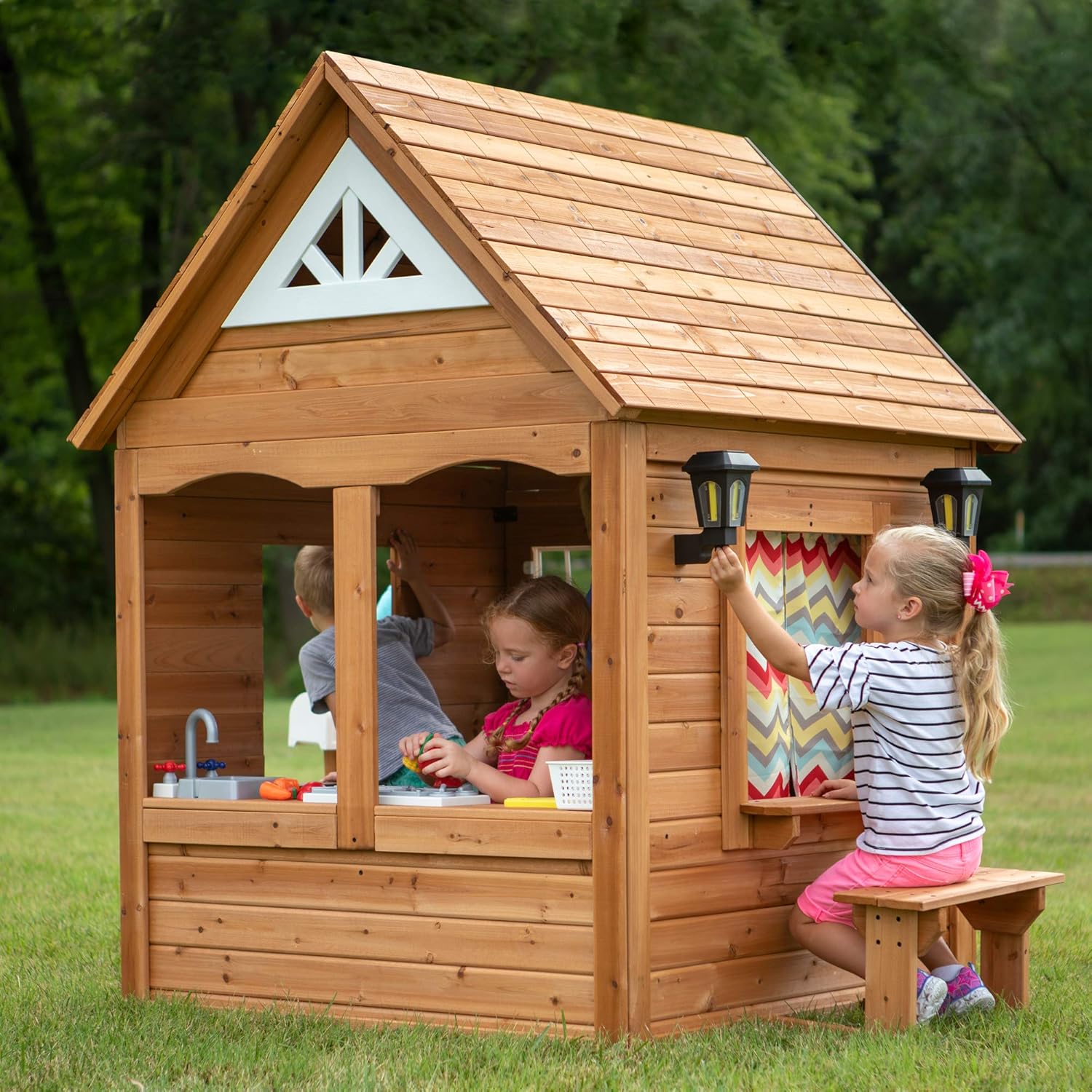 Backyard Discovery Aspen All Cedar Wooden Playhouse, Country Style, Dutch Front Door, Flower Pot Holders, Stove, Sink, Plastic Food, Doorbell, Mailbox, Outdoor Light Attached Picnic Bench